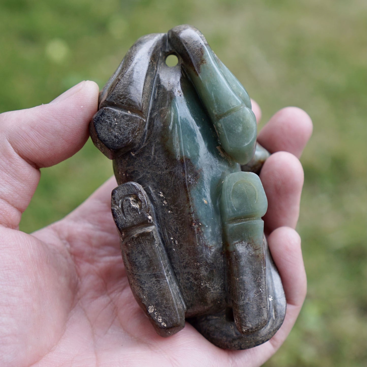 Jade round-carved sculpture of a reclining horse looking back