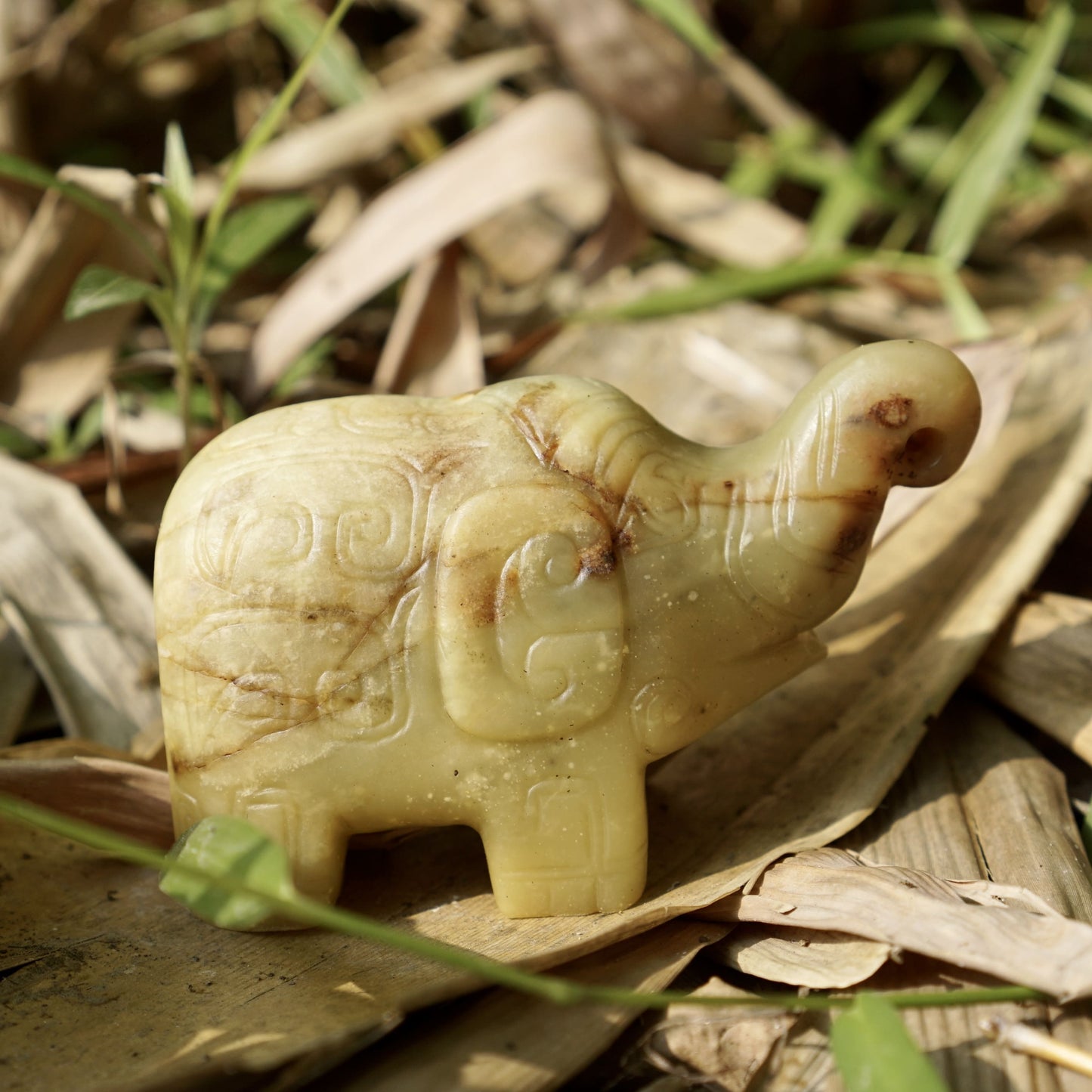 A round-carved jade elephant with inscriptions