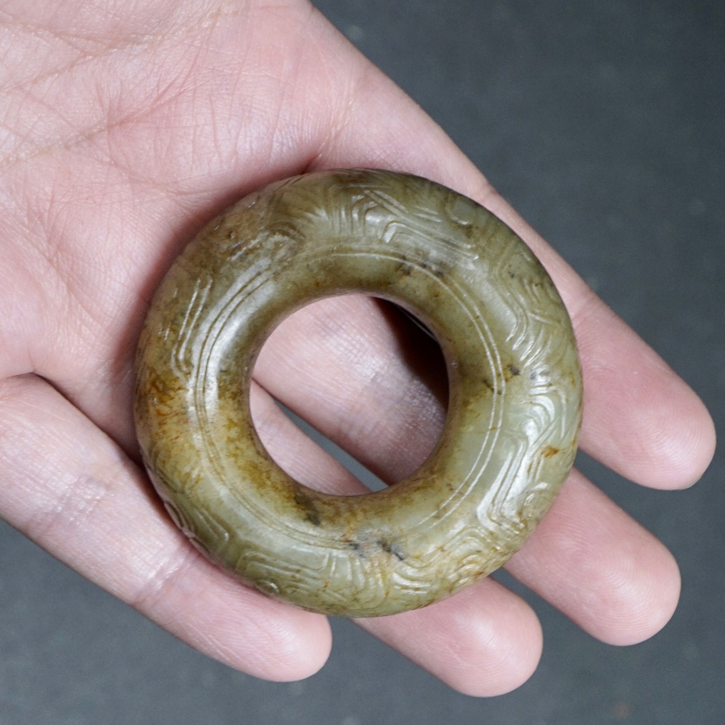 Jade ring with human face pattern